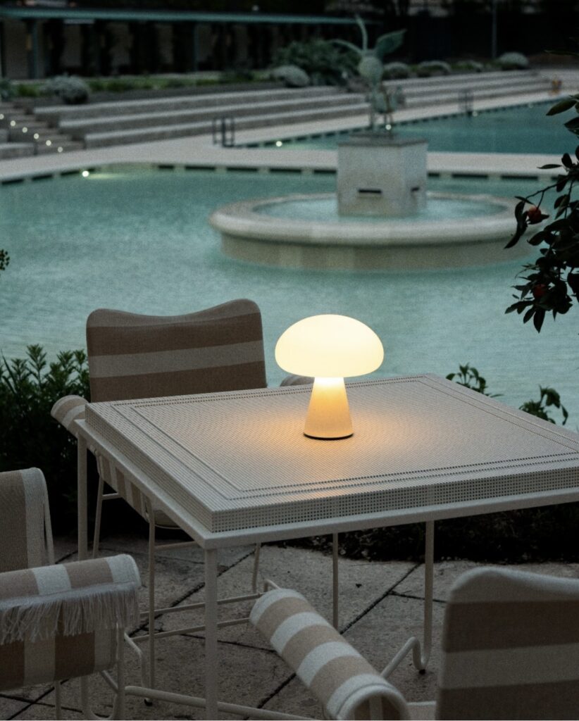 Gubi Obello portable lamp for inside and outside use.