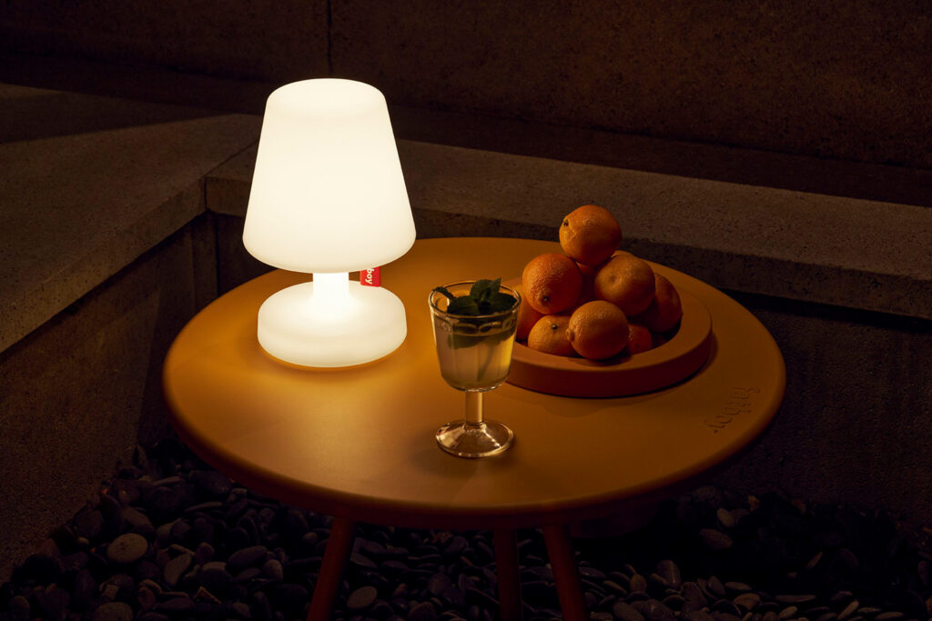 Fatboy Edison the Petit lamp in an outdoor environment lighting up.