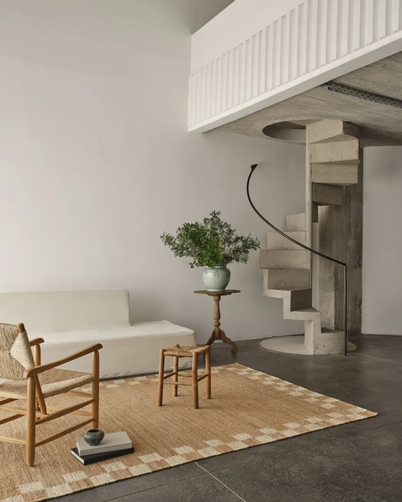 Nordic Knots Jute rug with a white checkered line around it in a Scandinavian minimalistic environment.