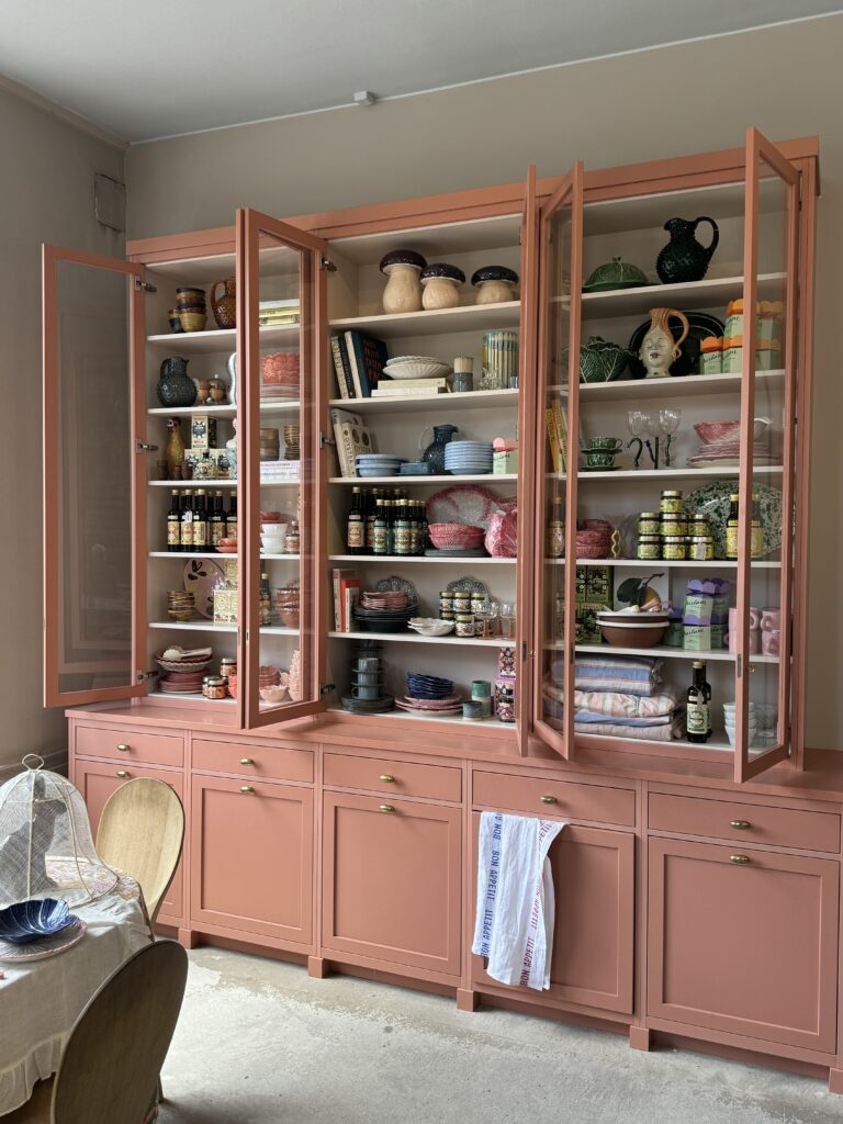 Swedish store Artilleriet in Gothenburg Sweden with a salmon pink cabinet.