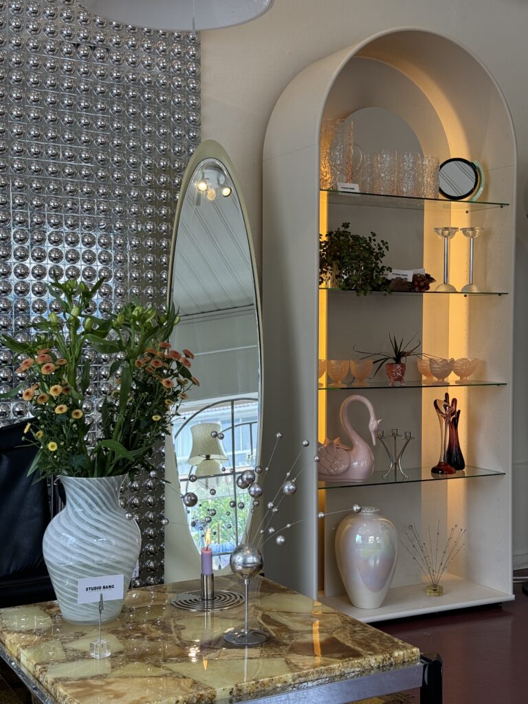 Vintage Interior Design with a beautiful Italian marble table and light up cabinet.