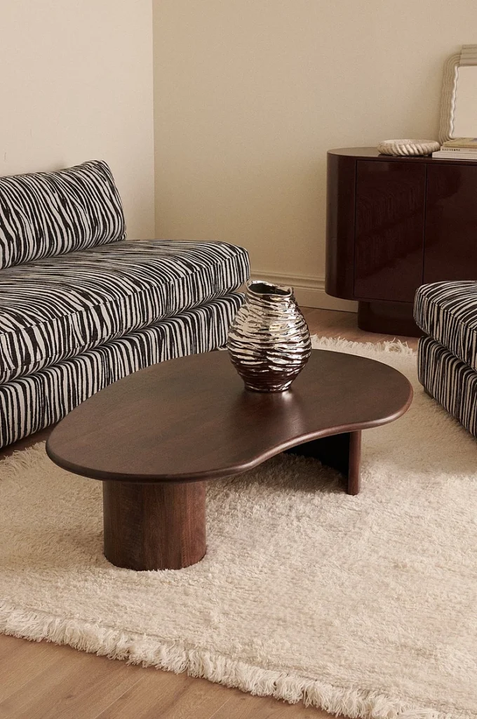 Organic shaped coffee table in dark wood